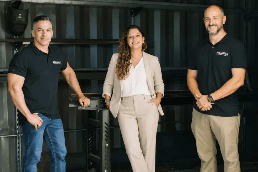 Three members of the WTR Structures team standing together
